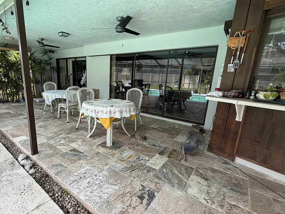 How Did Our Tile Floor Installation Transform This Poolside Patio in Palm Harbor, FL?